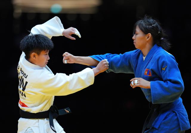 (260930) -- NAGOYA, Sept. 30, 2026 (Xinhua) -- Xu Aoyu (L) of China competes against Uranzaya Bayanmunkh of Mongolia during the Women's -52kg bronze medal match of Judo at the 20th Asian Games Aichi-Nagoya 2026 in Nagoya, Japan, Sept. 30, 2026. (Xinhua/Cheong Kam Ka)