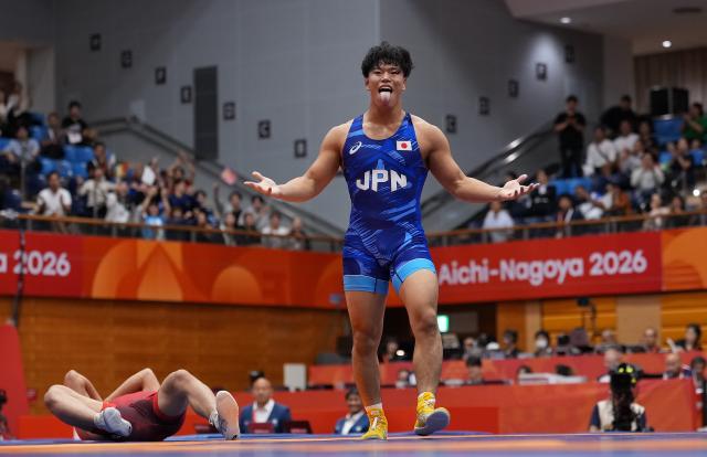 (260930) -- NAGOYA, Sept. 30, 2026 (Xinhua) -- Yoshida Taizo of Japan celebrates after winning the men's greco-roman 87kg final of Wrestling against Asan Kurbanovich Zhanyshov of Kyrgyzstan at the 20th Asian Games Aichi-Nagoya 2026 in Nagoya, Japan, Sept. 30, 2026. (Xinhua/Li Bo)