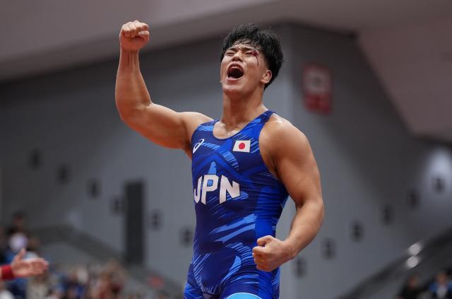(260930) -- NAGOYA, Sept. 30, 2026 (Xinhua) -- Yoshida Taizo of Japan celebrates after winning the men's greco-roman 87kg final of Wrestling against Asan Kurbanovich Zhanyshov of Kyrgyzstan at the 20th Asian Games Aichi-Nagoya 2026 in Nagoya, Japan, Sept. 30, 2026. (Xinhua/Li Bo)