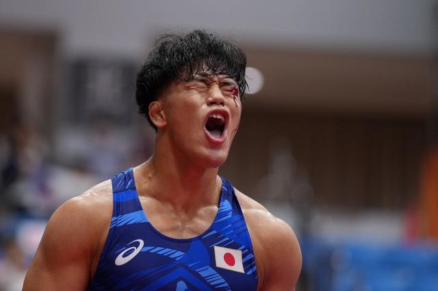 (260930) -- NAGOYA, Sept. 30, 2026 (Xinhua) -- Yoshida Taizo of Japan celebrates after winning the men's greco-roman 87kg final of Wrestling against Asan Kurbanovich Zhanyshov of Kyrgyzstan at the 20th Asian Games Aichi-Nagoya 2026 in Nagoya, Japan, Sept. 30, 2026. (Xinhua/Li Bo)