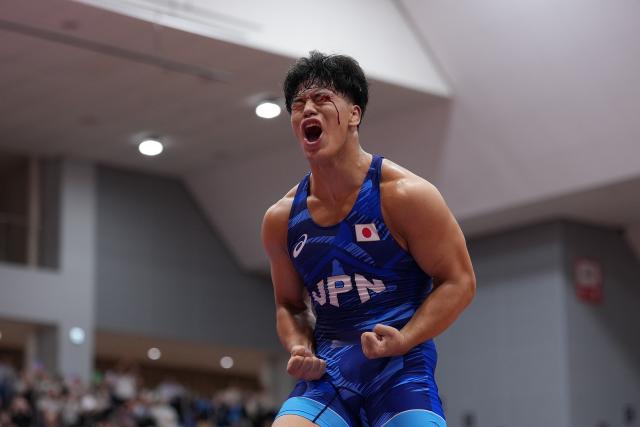 (260930) -- NAGOYA, Sept. 30, 2026 (Xinhua) -- Yoshida Taizo of Japan celebrates after winning the men's greco-roman 87kg final of Wrestling against Asan Kurbanovich Zhanyshov of Kyrgyzstan at the 20th Asian Games Aichi-Nagoya 2026 in Nagoya, Japan, Sept. 30, 2026. (Xinhua/Li Bo)