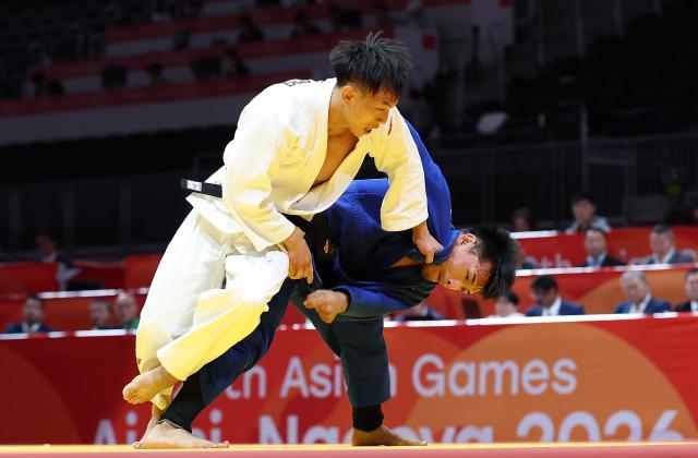 (260930) -- NAGOYA, Sept. 30, 2026 (Xinhua) -- Xue Ziyang (L) of China competes against Gusman Kyrgyzbayev of Kazakhstan during the Men's -66kg bronze medal match of Judo at the 20th Asian Games Aichi-Nagoya 2026 in Nagoya, Japan, Sept. 30, 2026. (Xinhua/Yao Qilin)