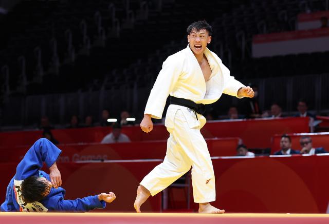 (260930) -- NAGOYA, Sept. 30, 2026 (Xinhua) -- Xue Ziyang (R) of China celebrates victory over Gusman Kyrgyzbayev of Kazakhstan after the Men's -66kg bronze medal match of Judo at the 20th Asian Games Aichi-Nagoya 2026 in Nagoya, Japan, Sept. 30, 2026. (Xinhua/Yao Qilin)