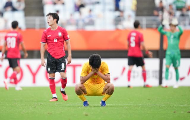 (260930) -- OSAKA, Sept. 30, 2026 (Xinhua) -- Yang Xi of China reacts after the men's football semifinal between China and South Korea at 20th Asian Games Aichi-Nagoya 2026 in Osaka, Japan, Sept. 30, 2026. (Xinhua/Lui Siu Wai)
