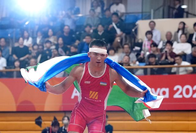 (260930) -- NAGOYA, Sept. 30, 2026 (Xinhua) -- Uzbekistan's Aytjan Khalmakhanov celebrates after winning Japan's Sogabe Kyotaro during the Men's Greco-Roman 67kg finals of Wrestling at the 20th Asian Games Aichi-Nagoya 2026 in Nagoya, Japan, Sept. 30, 2026. (Xinhua/Li Bo)