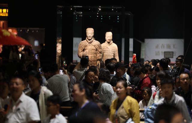 (260930) -- XI'AN, Sept. 30, 2026 (Xinhua) -- People visit the Pit No. 2 exhibition hall of the Emperor Qinshihuang's Mausoleum Site Museum in Xi'an, northwest China's Shaanxi Province, Sept. 30, 2026. The Pit No. 2 exhibition hall of the Emperor Qinshihuang's Mausoleum Site Museum has completed its renovation and will be open to the public during the National Day holiday. (Xinhua/Li Yibo)