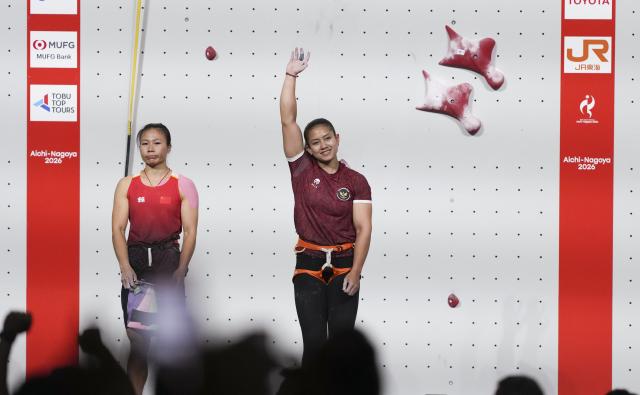 (260930) -- NAGOYA, Sept. 30, 2026 (Xinhua) -- Desak Made Rita Kusuma Dewi (R) of Indonesia and Deng Lijuan of China react after the women's speed 4 final of sport climbing at the 20th Asian Games Aichi-Nagoya 2026 in Nagoya, Japan, Sept. 30, 2026. (Xinhua/Jia Yuchen)