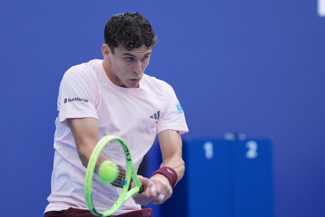 (260930) -- BEIJING, Sept. 30, 2026 (Xinhua) -- Juan Manuel Cerundolo of Argentina hits a return during the men's singles first round match against Bu Yunchaokete of China at 2026 China Open tennis tournament in Beijing, China, Sept. 30, 2026. (Xinhua/Xie Han)