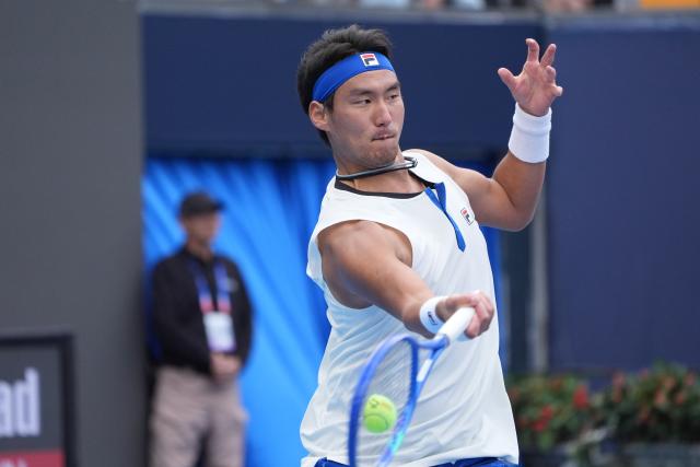 (260930) -- BEIJING, Sept. 30, 2026 (Xinhua) -- Bu Yunchaokete of China hits a return during the men's singles first round match against Juan Manuel Cerundolo of Argentina at 2026 China Open tennis tournament in Beijing, China, Sept. 30, 2026. (Xinhua/Xie Han)