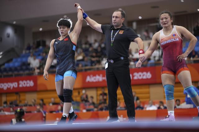 (260930) -- NAGOYA, Sept. 30, 2026 (Xinhua) -- Long Jia (L) of China wins against Mongolia's Delgermaa Enkhsaikhan during the Women's 68kg bronze medal match of Wrestling at the 20th Asian Games Aichi-Nagoya 2026 in Nagoya, Japan, Sept. 30, 2026. (Xinhua/Li Bo)