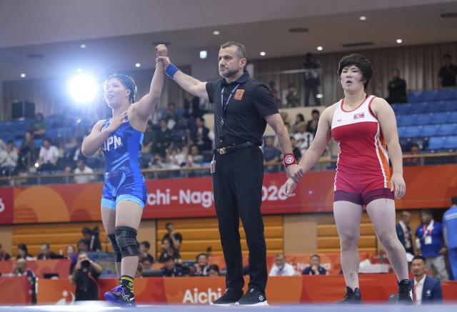 (260930) -- NAGOYA, Sept. 30, 2026 (Xinhua) -- Ishii Ami (L) of Japan wins against Pak Sol Gum of the Democratic People's Republic of Korea (DPRK) during the Women's 68kg final match of Wrestling at the 20th Asian Games Aichi-Nagoya 2026 in Nagoya, Japan, Sept. 30, 2026. (Xinhua/Li Bo)