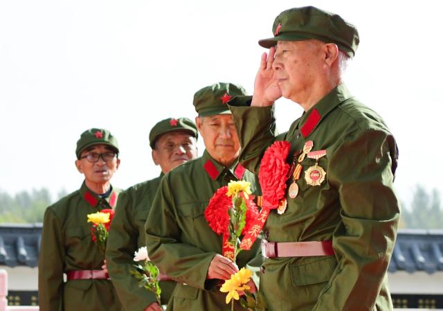 (260930) -- BEIJING, Sept. 30, 2026 (Xinhua) -- Veterans salute to a monument for martyrs at a martyrs' cemetery in Suihua City, northeast China's Heilongjiang Province, Sept. 30, 2026. Commemorative events were held across China to mark Martyrs' Day in recent days. Observed on Sept. 30, one day before National Day, the day commemorates those who gave their lives for national independence and prosperity. (Photo by Liu Huapeng/Xinhua)