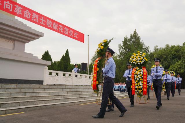 (260930) -- BEIJING, Sept. 30, 2026 (Xinhua) -- A ceremony to present flower baskets to martyrs is held at a martyrs' cemetery in Qinyang City, central China's Henan Province, Sept. 30, 2026. Commemorative events were held across China to mark Martyrs' Day in recent days. Observed on Sept. 30, one day before National Day, the day commemorates those who gave their lives for national independence and prosperity. (Photo by Zhang Xinyu/Xinhua)
