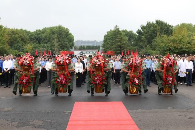 (260930) -- BEIJING, Sept. 30, 2026 (Xinhua) -- People take part in a commemorative event at a martyrs' cemetery in Baoying County, east China's Jiangsu Province, Sept. 30, 2026. Commemorative events were held across China to mark Martyrs' Day in recent days. Observed on Sept. 30, one day before National Day, the day commemorates those who gave their lives for national independence and prosperity. (Photo by Shen Dongbing/Xinhua)