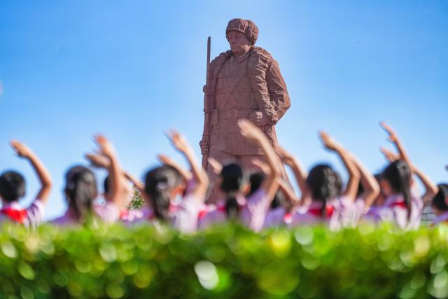 (260930) -- BEIJING, Sept. 30, 2026 (Xinhua) -- Students salute to a monument at a martyrs' cemetery in Binhai New Area of Tianjin, north China, Sept. 30, 2026. Commemorative events were held across China to mark Martyrs' Day in recent days. Observed on Sept. 30, one day before National Day, the day commemorates those who gave their lives for national independence and prosperity. (Photo by Du Penghui/Xinhua)