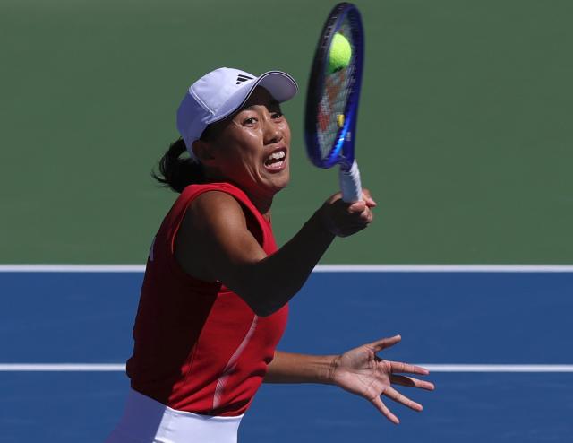 (261001) -- NAGOYA, Oct. 1, 2026 (Xinhua) -- Zhang Shuai of China returns the ball during the women's singles semifinals of tennis against Yuliya Putintseva of Kazakhstan at the 20th Asian Games Aichi-Nagoya 2026 in Nagoya, Japan, Oct. 1, 2026. (Xinhua/Li Bo)