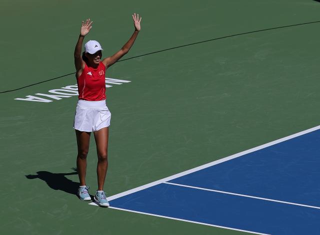(261001) -- NAGOYA, Oct. 1, 2026 (Xinhua) -- Zhang Shuai of China celebrates after the women's singles semifinals of tennis against Yuliya Putintseva of Kazakhstan at the 20th Asian Games Aichi-Nagoya 2026 in Nagoya, Japan, Oct. 1, 2026. (Xinhua/Li Bo)