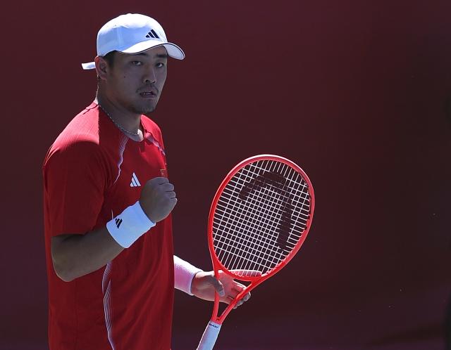 (261001) -- NAGOYA, Oct. 1, 2026 (Xinhua) -- Wu Yibing of China celebrates during the men's singles quarterfinals of tennis against Sumit Nagal of India at the 20th Asian Games Aichi-Nagoya 2026 in Nagoya, Japan, Oct. 1, 2026. (Xinhua/Li Bo)