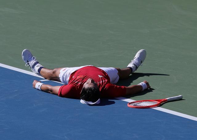 (261001) -- NAGOYA, Oct. 1, 2026 (Xinhua) -- Wu Yibing of China celebrates after the men's singles quarterfinals of tennis against Sumit Nagal of India at the 20th Asian Games Aichi-Nagoya 2026 in Nagoya, Japan, Oct. 1, 2026. (Xinhua/Li Bo)