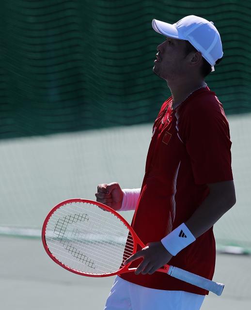 (261001) -- NAGOYA, Oct. 1, 2026 (Xinhua) -- Wu Yibing of China celebrates during the men's singles quarterfinals of tennis against Sumit Nagal of India at the 20th Asian Games Aichi-Nagoya 2026 in Nagoya, Japan, Oct. 1, 2026. (Xinhua/Li Bo)