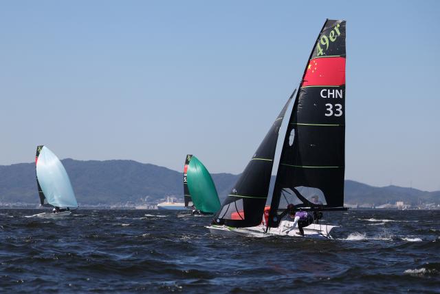 (261001) -- GAMAGORI, Oct. 1, 2026 (Xinhua) -- Liu Tian and Wen Zaiding of China compete during the Men's Skiff Opening Series Race of Sailing at the 20th Asian Games Aichi-Nagoya 2026 in Gamagori of Aichi Prefecture, Japan, Oct. 1, 2026. (Xinhua/Deng Hua)