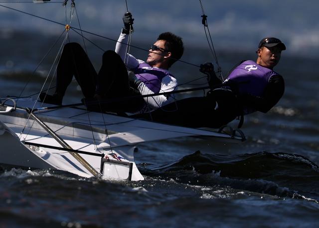(261001) -- GAMAGORI, Oct. 1, 2026 (Xinhua) -- Liu Tian (L) and Wen Zaiding of China compete during the Men's Skiff Opening Series Race of Sailing at the 20th Asian Games Aichi-Nagoya 2026 in Gamagori of Aichi Prefecture, Japan, Oct. 1, 2026. (Xinhua/Deng Hua)