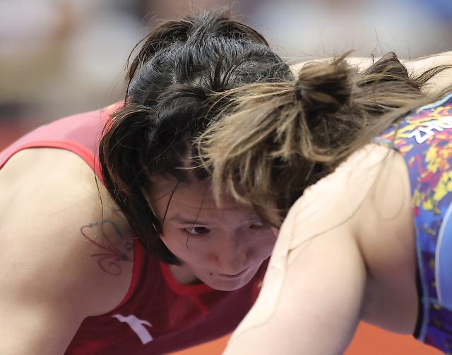 (261001) -- NAGOYA, Oct. 1, 2026 (Xinhua) -- Zhang Qi (L) of China competes with Sezim Zhumanazarova of Kyrgyzstan during their Women's 62kg 1/4 Final bout of Wrestling at the 20th Asian Games Aichi-Nagoya 2026 in Nagoya, Japan, Oct. 1, 2026 (Xinhua/Long Lei)