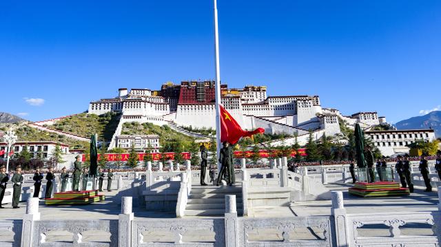 (261001) -- BEIJING, Oct. 1, 2026 (Xinhua) -- A flag-raising ceremony marking the 77th anniversary of the founding of the People's Republic of China is held at the Potala Palace square in Lhasa, southwest China's Xizang Autonomous Region, Oct. 1, 2026. People celebrated the 77th anniversary of the founding of the People's Republic of China in various ways on Thursday. (Xinhua/Jigme Dorje)