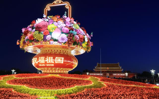 (261001) -- BEIJING, Oct. 1, 2026 (Xinhua) -- This photo taken on Oct. 1, 2026 shows a "flower basket" installation at Tian'anmen Square in Beijing, capital of China. People celebrated the 77th anniversary of the founding of the People's Republic of China in various ways on Thursday. (Xinhua/Yin Gang)