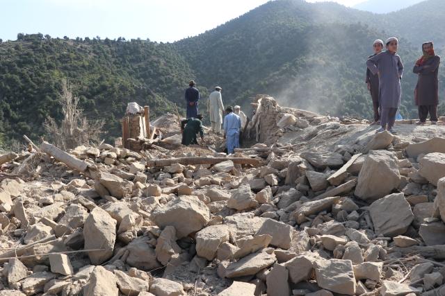 (261001) -- KUNAR, Oct. 1, 2026 (Xinhua) -- This photo taken on Oct. 1, 2026 shows people clearing debris at a village after an airstrike in Kunar province, Afghanistan. Afghan government spokesperson Zabihullah Mujahid said on Thursday that Pakistani airstrikes hit the eastern Afghan province of Kunar early in the day, killing nine people and injuring 11 others, while three houses were also damaged. (Photo by Qazafi Mal/Xinhua)