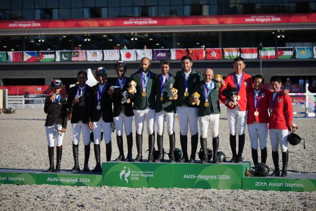 (261001) -- TOKYO, Oct. 1, 2026 (Xinhua) -- Gold medalists team Saudi Arabia (C), silver medalists team the United Arab Emirates (L) and bronze medalists team Japan pose during the awarding ceremony for the jumping team of equestrian at the 20th Asian Games Aichi-Nagoya 2026 in Tokyo, Japan, Oct. 1, 2026. (Photo by Wang Shen/Xinhua)