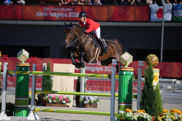 (261001) -- TOKYO, Oct. 1, 2026 (Xinhua) -- Sato Eiken of team Japan competes during the jumping team final of equestrian at the 20th Asian Games Aichi-Nagoya 2026 in Tokyo, Japan, Oct. 1, 2026. (Photo by Wang Shen/Xinhua)