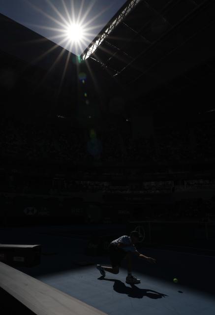 (261001) -- BEIJING, Oct. 1, 2026 (Xinhua) -- A ball kid passes the ball during the women's singles first round match between Zheng Qinwen of China and Shi Han of China at 2026 China Open tennis tournament in Beijing, China, Oct. 1, 2026. (Xinhua/Bai Xuefei)
