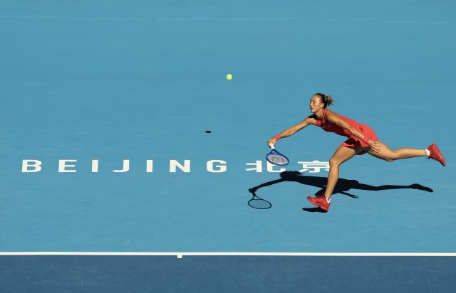 (261001) -- BEIJING, Oct. 1, 2026 (Xinhua) -- Zheng Qinwen competes during the women's singles first round match between Zheng Qinwen of China and Shi Han of China at 2026 China Open tennis tournament in Beijing, China, Oct. 1, 2026. (Xinhua/Bai Xuefei)