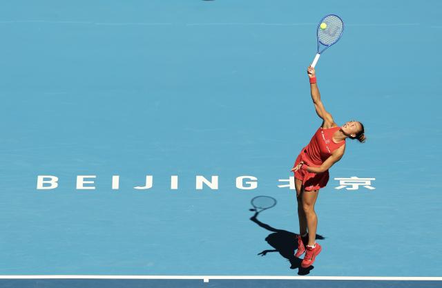 (261001) -- BEIJING, Oct. 1, 2026 (Xinhua) -- Zheng Qinwen competes during the women's singles first round match between Zheng Qinwen of China and Shi Han of China at 2026 China Open tennis tournament in Beijing, China, Oct. 1, 2026. (Xinhua/Bai Xuefei)