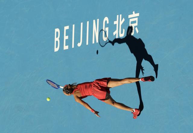 (261001) -- BEIJING, Oct. 1, 2026 (Xinhua) -- Zheng Qinwen competes during the women's singles first round match between Zheng Qinwen of China and Shi Han of China at 2026 China Open tennis tournament in Beijing, China, Oct. 1, 2026. (Xinhua/Bai Xuefei)
