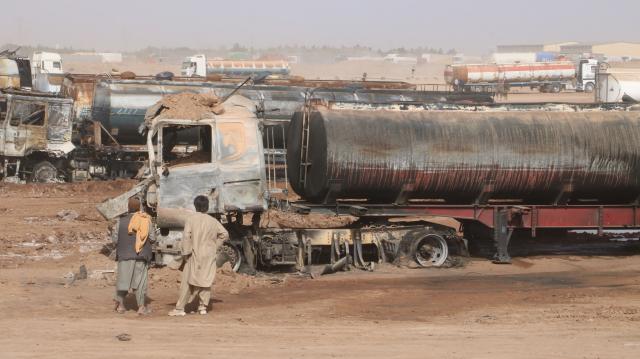 (261001) -- KABUL, Oct. 1, 2026 (Xinhua) -- This photo taken on Oct. 1, 2026 shows the site of a fire at the Islam Qala border crossing in Herat province, Afghanistan. At least 18 fuel tankers were fully engulfed in flames and three others partially damaged when a major fire erupted at the Islam Qala border crossing in western Afghanistan's Herat province on Wednesday evening, the National Disaster Management Authority announced on Thursday. (Photo by Mashal/Xinhua)