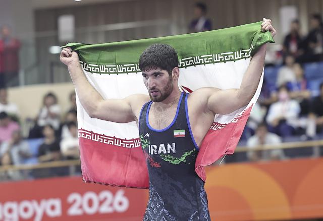 (261001) -- NAGOYA, Oct. 1, 2026 (Xinhua) -- Alireza Abdevali of Iran celebrates victory over Kusaka Nao of Japan after the Men's Greco-Roman 77kg final of wrestling at the 20th Asian Games Aichi-Nagoya 2026 in Nagoya, Japan, Oct.1, 2026. (Xinhua/Long Lei)