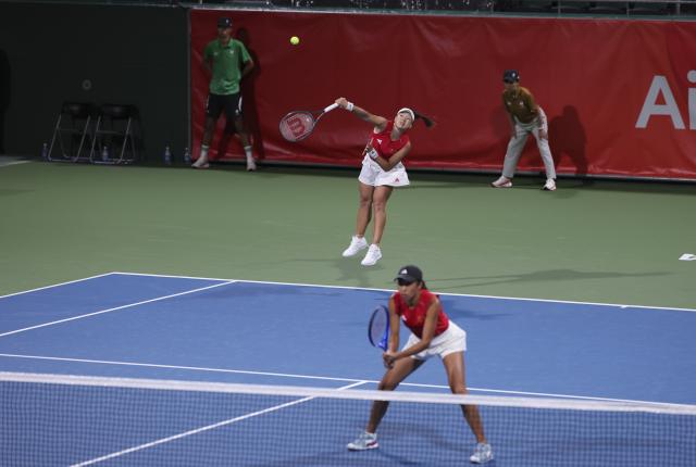 (261001) -- NAGOYA, Oct. 1, 2026 (Xinhua) -- Guo Hanyu (L)/Zhang Shuai of China compete during the women's doubles quarterfinals of tennis against Chan Hao-ching/Wu Fang-hsien of Chinese Taipei at the 20th Asian Games Aichi-Nagoya 2026 in Nagoya, Japan, Oct. 1, 2026. (Xinhua/Li Bo)