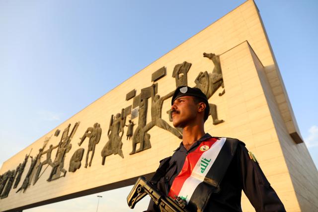 (261001) -- BAGHDAD, Oct. 1, 2026 (Xinhua) -- An Iraqi security officer stands guard at Tahrir Square in Baghdad, Iraq, Sept. 30, 2026. Ali al-Zaidi, Iraqi prime minister and commander-in-chief of the armed forces, on Wednesday officially announced the conclusion of the U.S.-led international coalition's mission to combat the Islamic State (IS) in Iraq.
  He made the announcement during an official ceremony in Baghdad marking Iraq's Sovereignty Day and the conclusion of the coalition's mission, according to a statement from al-Zaidi's media office. (Xinhua/Khalil Dawood)