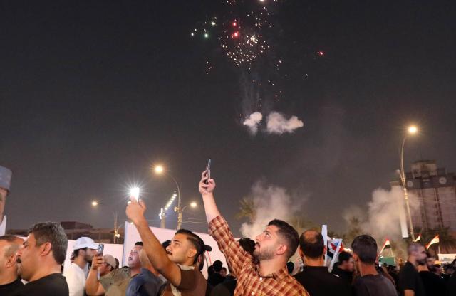 (261001) -- BAGHDAD, Oct. 1, 2026 (Xinhua) -- People watch fireworks at Tahrir Square in Baghdad, Iraq, Sept. 30, 2026. Ali al-Zaidi, Iraqi prime minister and commander-in-chief of the armed forces, on Wednesday officially announced the conclusion of the U.S.-led international coalition's mission to combat the Islamic State (IS) in Iraq.
  He made the announcement during an official ceremony in Baghdad marking Iraq's Sovereignty Day and the conclusion of the coalition's mission, according to a statement from al-Zaidi's media office. (Xinhua/Khalil Dawood)