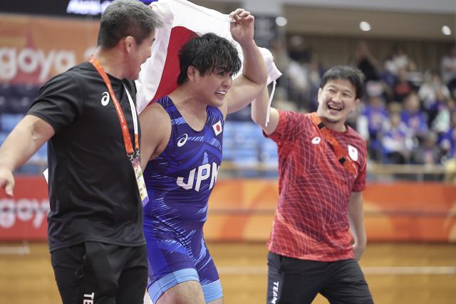 (261001) -- NAGOYA, Oct. 1, 2026 (Xinhua) -- Nakazato Yuri (C) of Japan celebrates after competing with Nitesh of India during the men's Greco-Roman 97kg final match of Wrestling at the 20th Asian Games Aichi-Nagoya 2026 in Nagoya, Japan, Oct. 1, 2026. (Xinhua/Long Lei)