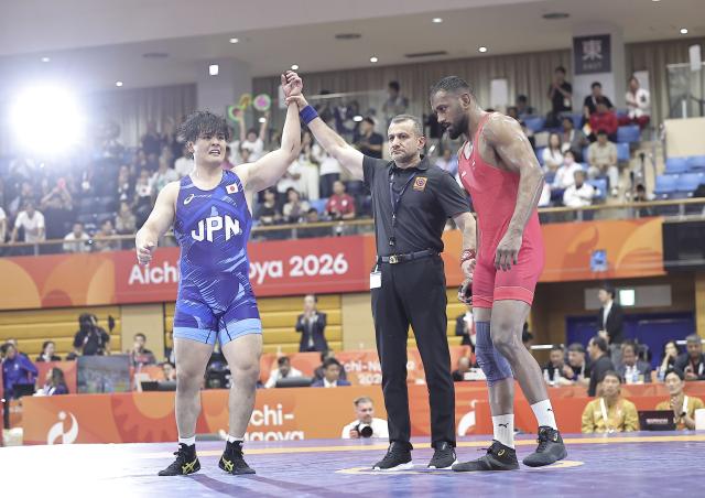 (261001) -- NAGOYA, Oct. 1, 2026 (Xinhua) -- Nakazato Yuri (L) of Japan is announced winner after defeating Nitesh of India during the men's Greco-Roman 97kg final match of Wrestling at the 20th Asian Games Aichi-Nagoya 2026 in Nagoya, Japan, Oct. 1, 2026. (Xinhua/Long Lei)