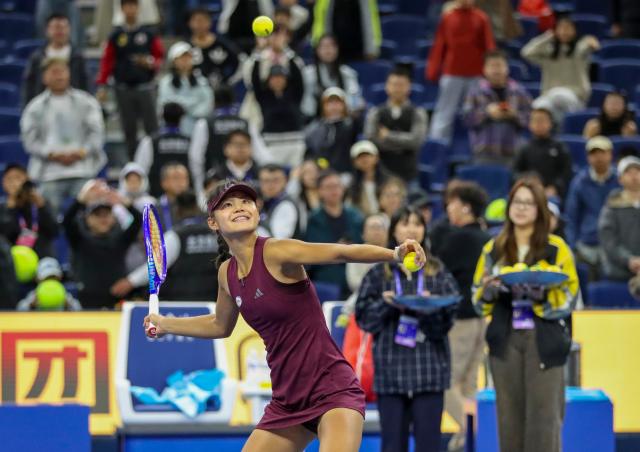 (261001) -- BEIJING, Oct. 1, 2026 (Xinhua) -- Sun Xinran of China sends balls to spectators after the women's singles first round match against Eva Lys of Germany at 2026 China Open tennis tournament in Beijing, China, Oct. 1, 2026. (Xinhua/Ma Zihan)