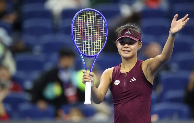 (261001) -- BEIJING, Oct. 1, 2026 (Xinhua) -- Sun Xinran of China waves to spectators after the women's singles first round match against Eva Lys of Germany at 2026 China Open tennis tournament in Beijing, China, Oct. 1, 2026. (Xinhua/Ma Zihan)