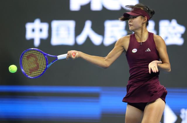(261001) -- BEIJING, Oct. 1, 2026 (Xinhua) -- Sun Xinran of China hits a return during the women's singles first round match against Eva Lys of Germany at 2026 China Open tennis tournament in Beijing, China, Oct. 1, 2026. (Xinhua/Ma Zihan)