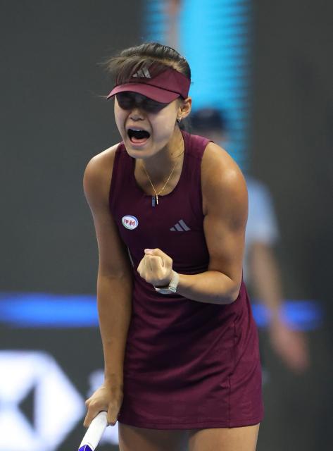 (261001) -- BEIJING, Oct. 1, 2026 (Xinhua) -- Sun Xinran of China celebrates during the women's singles first round match against Eva Lys of Germany at 2026 China Open tennis tournament in Beijing, China, Oct. 1, 2026. (Xinhua/Ma Zihan)