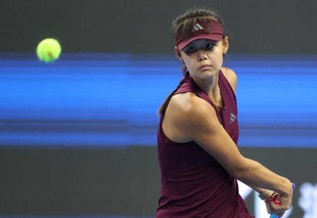 (261001) -- BEIJING, Oct. 1, 2026 (Xinhua) -- Sun Xinran of China hits a return during the women's singles first round match against Eva Lys of Germany at 2026 China Open tennis tournament in Beijing, China, Oct. 1, 2026. (Xinhua/Ma Zihan)