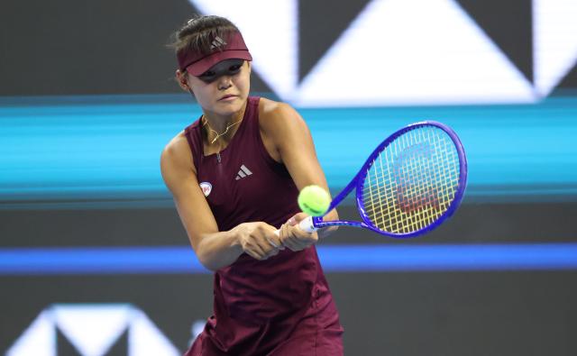 (261001) -- BEIJING, Oct. 1, 2026 (Xinhua) -- Sun Xinran of China hits a return during the women's singles first round match against Eva Lys of Germany at 2026 China Open tennis tournament in Beijing, China, Oct. 1, 2026. (Xinhua/Ma Zihan)