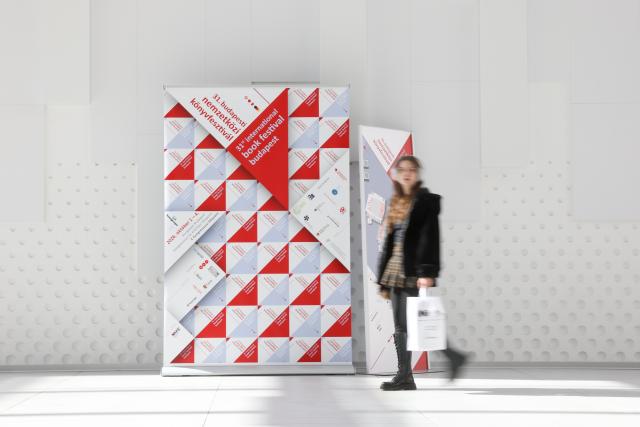 (261001) -- BUDAPEST, Oct. 1, 2026 (Xinhua) -- A woman walks past a display board at the 31st Budapest International Book Festival in Budapest, Hungary, Oct. 1, 2026. The 31st Budapest International Book Festival opened in Budapest, Hungary, on Thursday and runs through Oct. 4. (Xinhua/Hu Zhixuan)